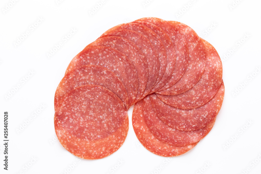 Salami slices on white background. Salami slices on white background.