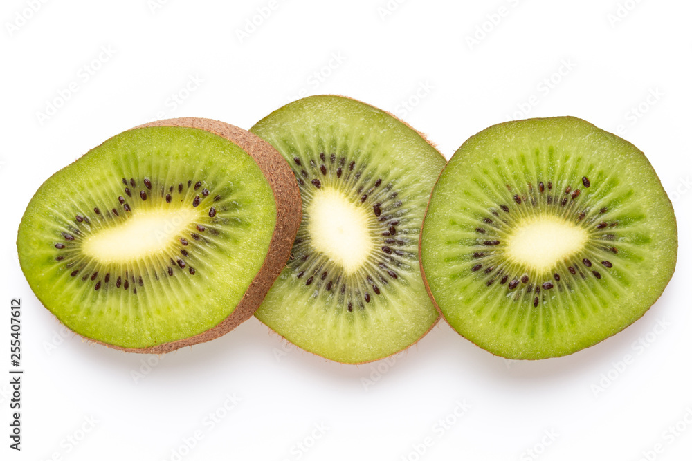 Kiwi fruit slices on white background. Kiwi fruit slices on white background.
