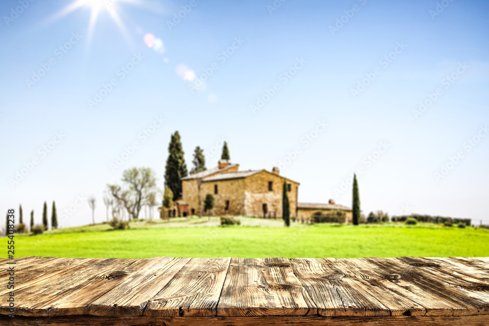 Fototapeta premium desk of free space and tuscany landscape 
