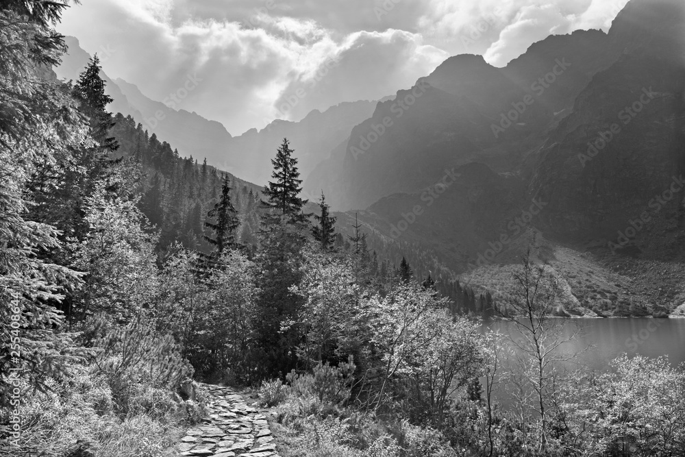 High Tatras - Tourist way round of Morskie Oko lake in the backlight