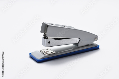 Big silver stapler is isolated on a white background