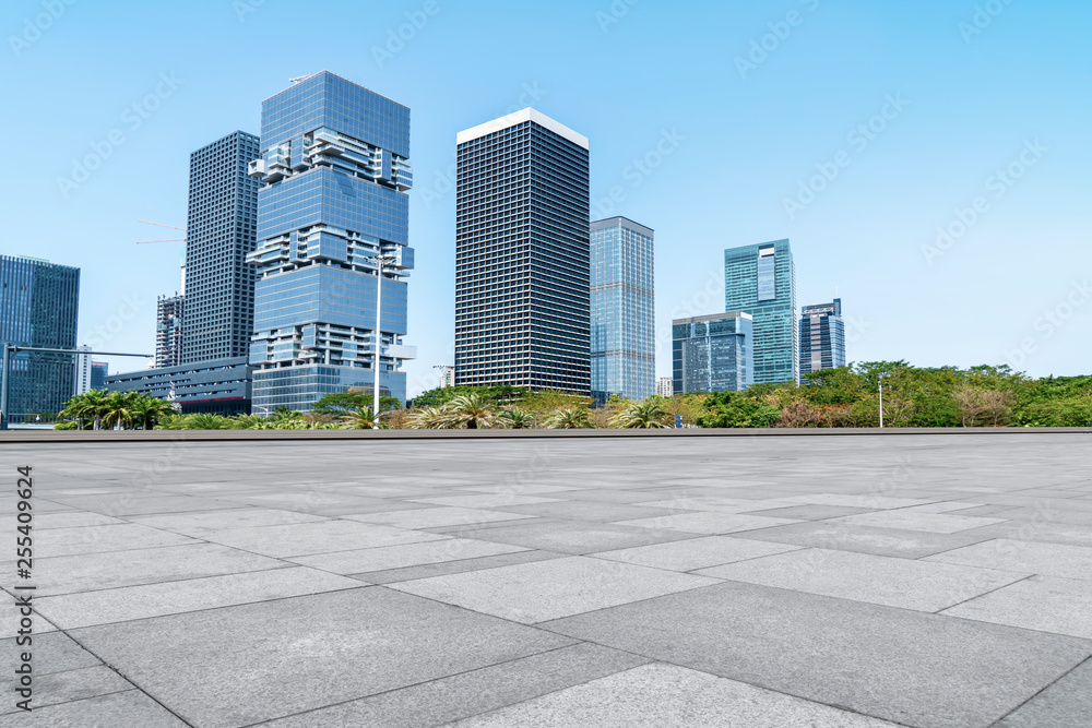 Urban skyscrapers with empty square floor tiles Urban skyscrapers with empty square floor tiles