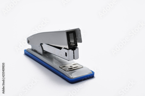 Big silver stapler is isolated on a white background