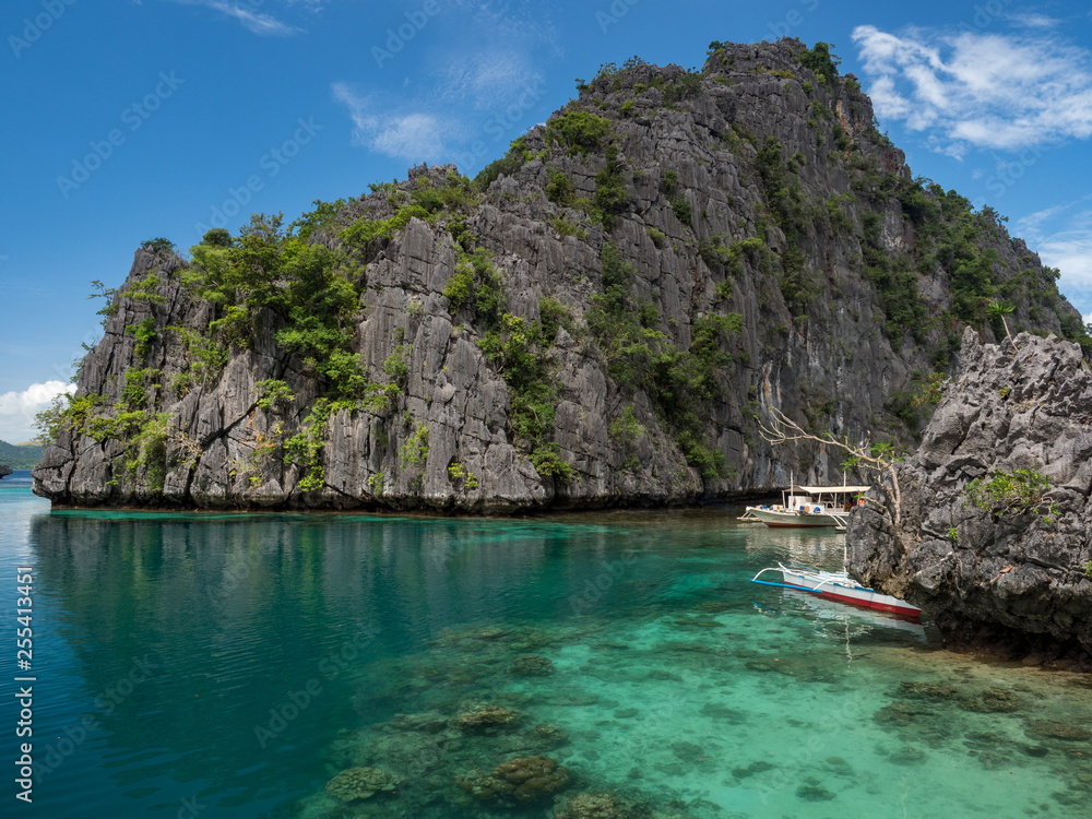 Stones of Barracuda lake on Coron Island. Lake surrounded by limestone cliffs, is a popular tourist attraction and diving spot at the Philippines. October, 2018