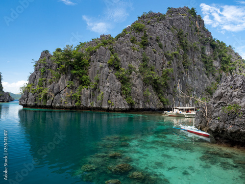 Stones of Barracuda lake on Coron Island. Lake surrounded by limestone cliffs, is a popular tourist attraction and diving spot at the Philippines. October, 2018 © ikmerc