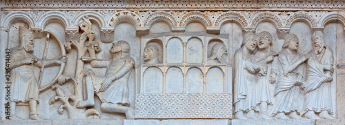 MODENA, ITALY - APRIL 14, 2018: The romanesque relief of Kain and Abel from paradise on the facade of Duomo di Modena.