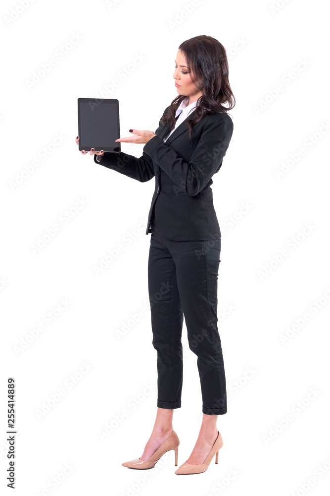 Confident elegant business woman showing blank black pad display. Full body isolated on white background. Confident elegant business woman showing blank black pad display. Full body isolated on white background.