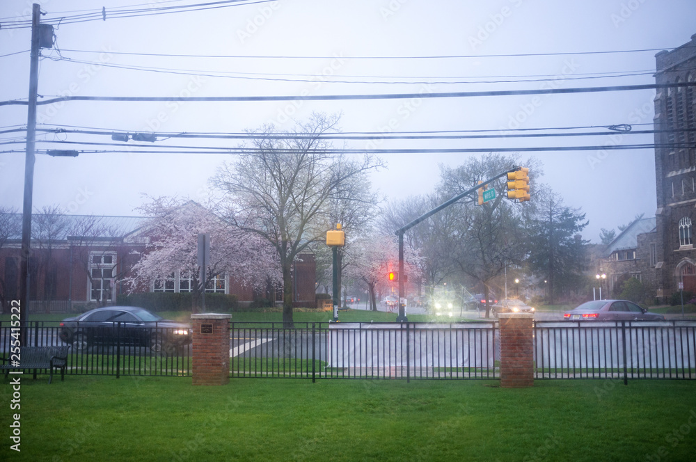 small town under pouring rain at the beginning of spring