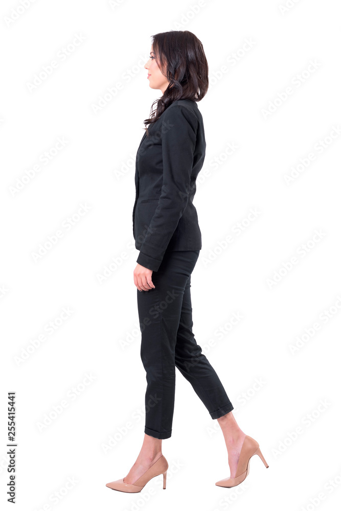 Profile view of elegant business woman in suit stepping forward. Full body isolated on white background. Profile view of elegant business woman in suit stepping forward. Full body isolated on white background.