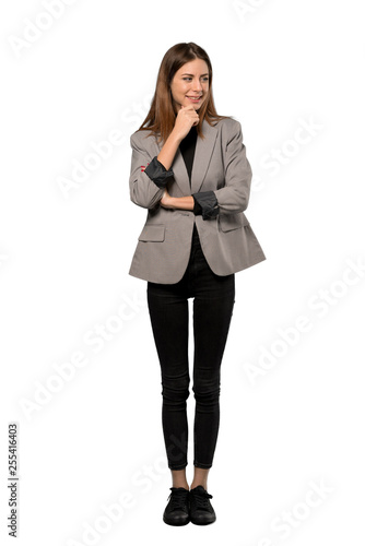 A full-length shot of a Business woman looking to the side over isolated white background