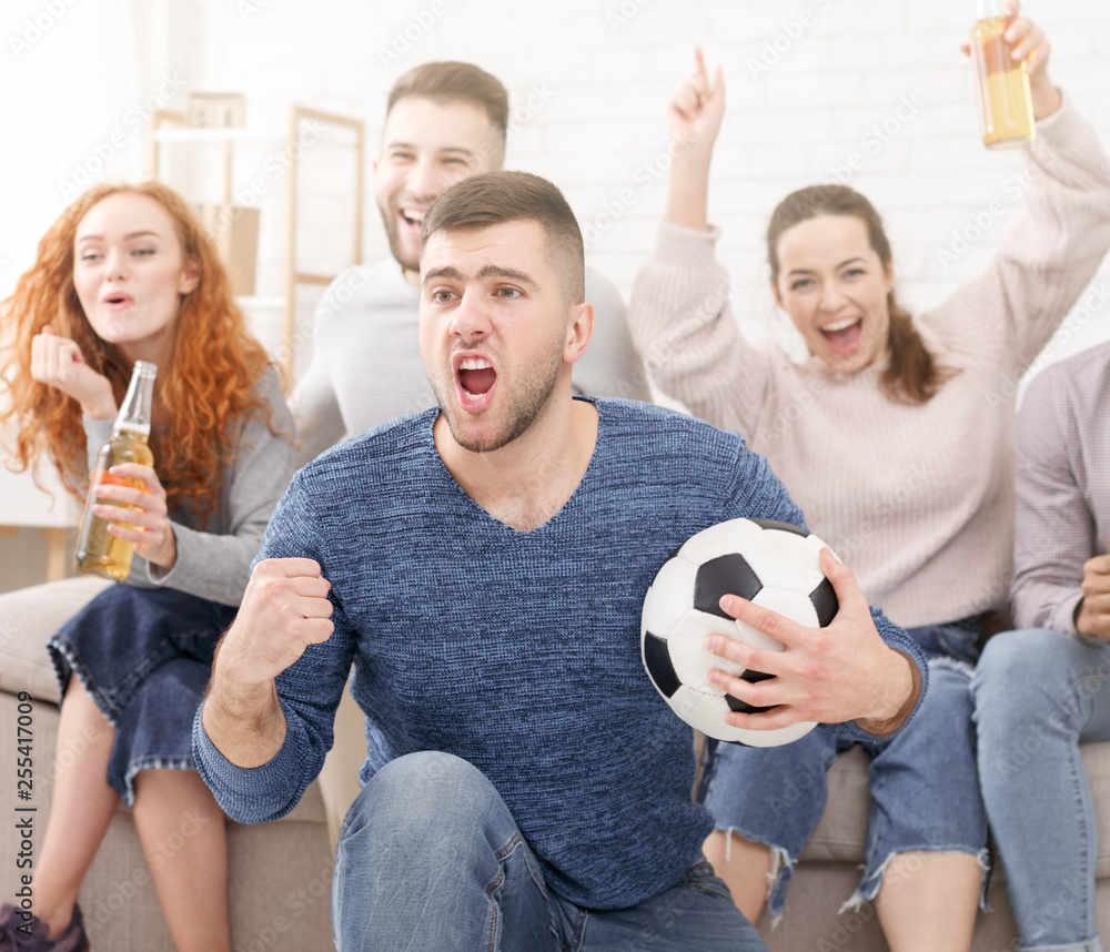 Football fans celebrating victory of favourite team