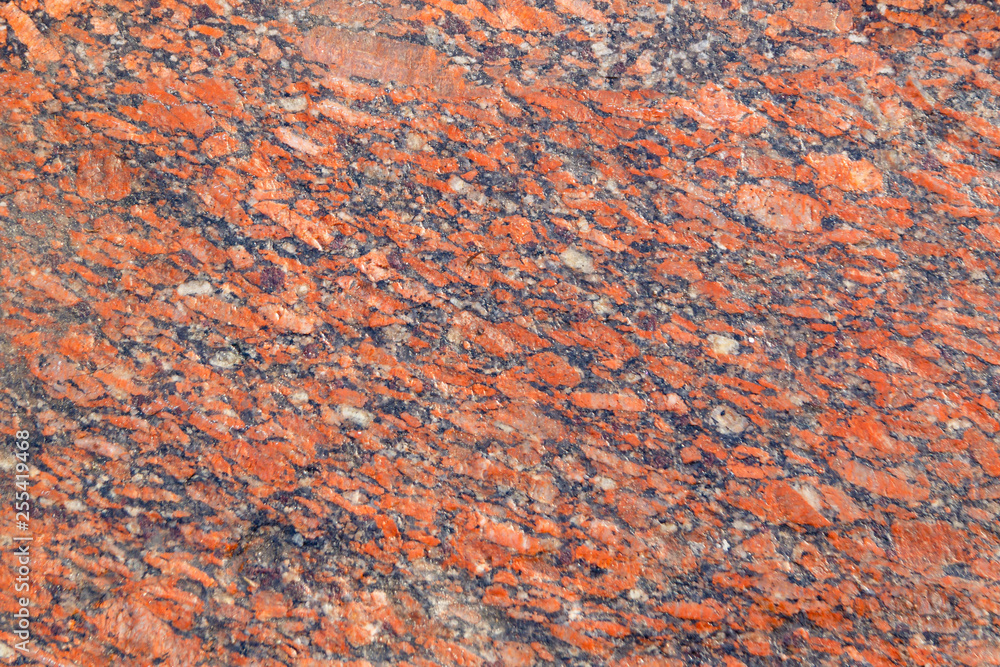 Natural mountain red granite background with impregnation of minerals Natural mountain red granite background with impregnation of minerals