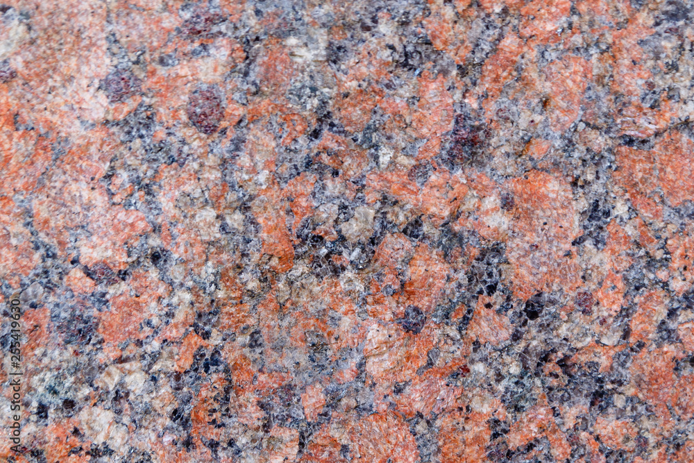Natural mountain red granite background with impregnation of minerals Natural mountain red granite background with impregnation of minerals