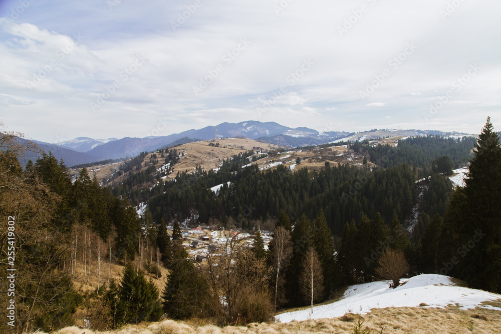 Spring vs winter landscape in the Carpathian mountains