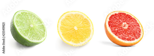 Set of fresh cut ripe citrus fruits on white background © New Africa