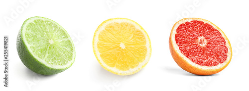 Set of fresh cut ripe citrus fruits on white background