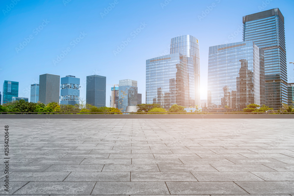 Urban skyscrapers with empty square floor tiles