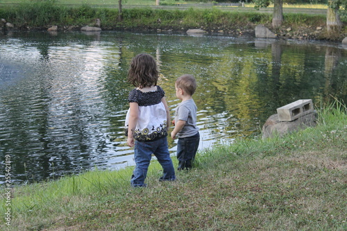 two kids on lake