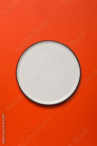 White plate on red background