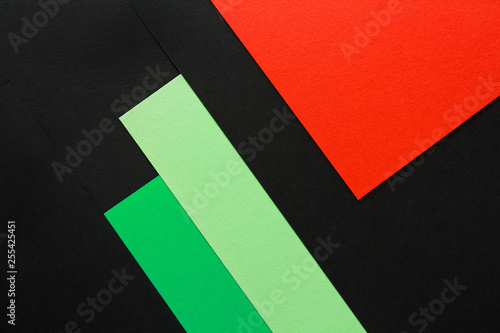 color geometric background of black  green and red paper