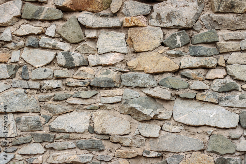wild decorate stone wall texture. natural facade home dry background. old grunge rocks retro vintage wallpaper wild decorate stone wall texture. natural facade home dry background. old grunge rocks retro vintage wallpaper