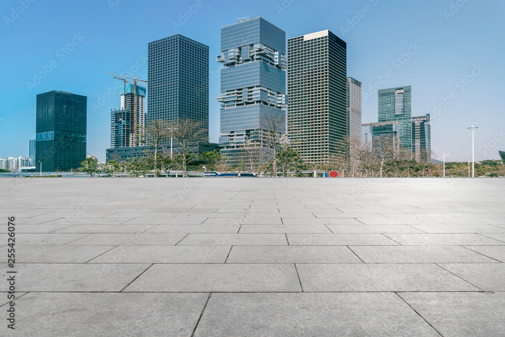 Urban skyscrapers with empty square floor tiles Urban skyscrapers with empty square floor tiles