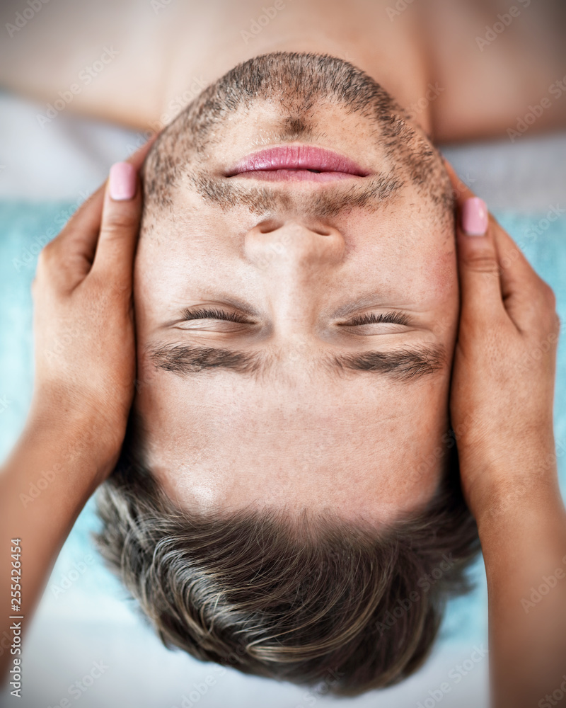 Handsome man having massage in spa salon Handsome man having massage in spa salon