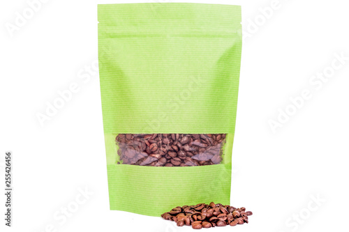 green paper doypack stand up pouch with window  zipper  filled with coffee beans on white background photo