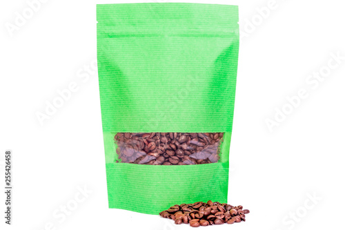 green stripped paper doypack stand up pouch with window  zipper  filled with coffee beans on white background photo