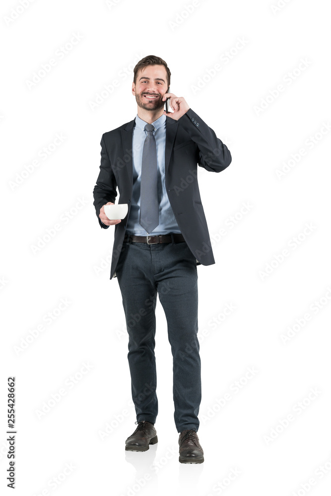 Smiling businessman with coffee on phone, isolated Smiling businessman with coffee on phone, isolated