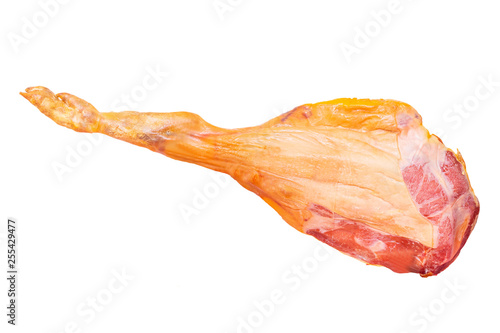 Spanish ham. Closeup of a front leg of traditional spanish Serrano ham (Jamon) or italian parma prosciutto crudo isolated on a white background. Macro. photo