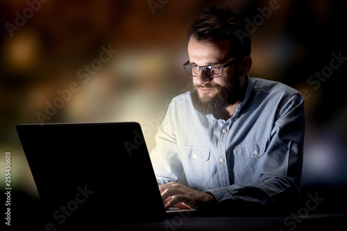 Young handsome businessman working late at night in the office © ra2 studio