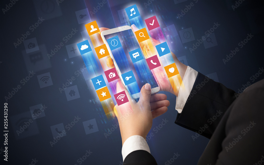 Female hand using smartphone with colorful angular fast switching application icons around Female hand using smartphone with colorful angular fast switching application icons around