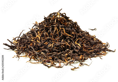 Heap of black tea on white background. Close up. High resolution.