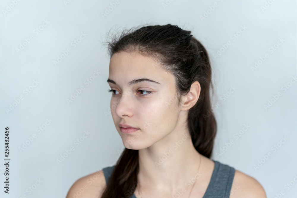 Fototapeta premium portrait of a young teen girl with indifference looking to the side