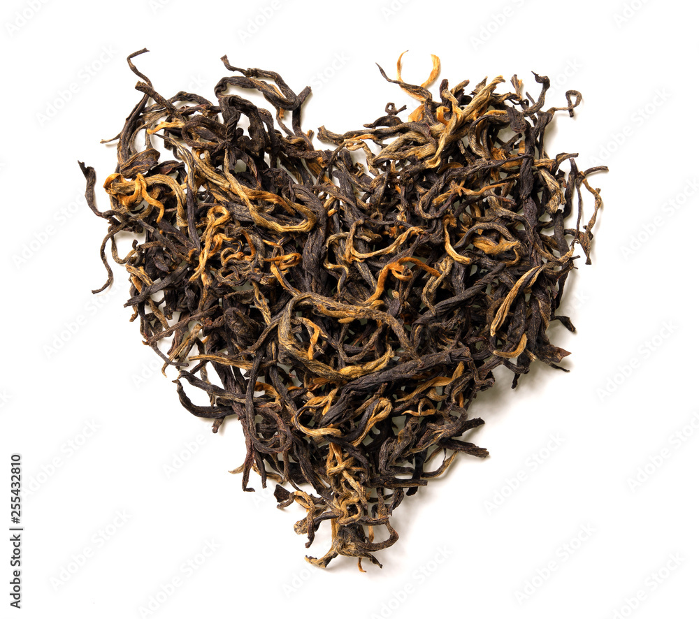 Heart shaped from black tea isolated on white background. Top view. Close up. High resolution Heart shaped from black tea isolated on white background. Top view. Close up. High resolution