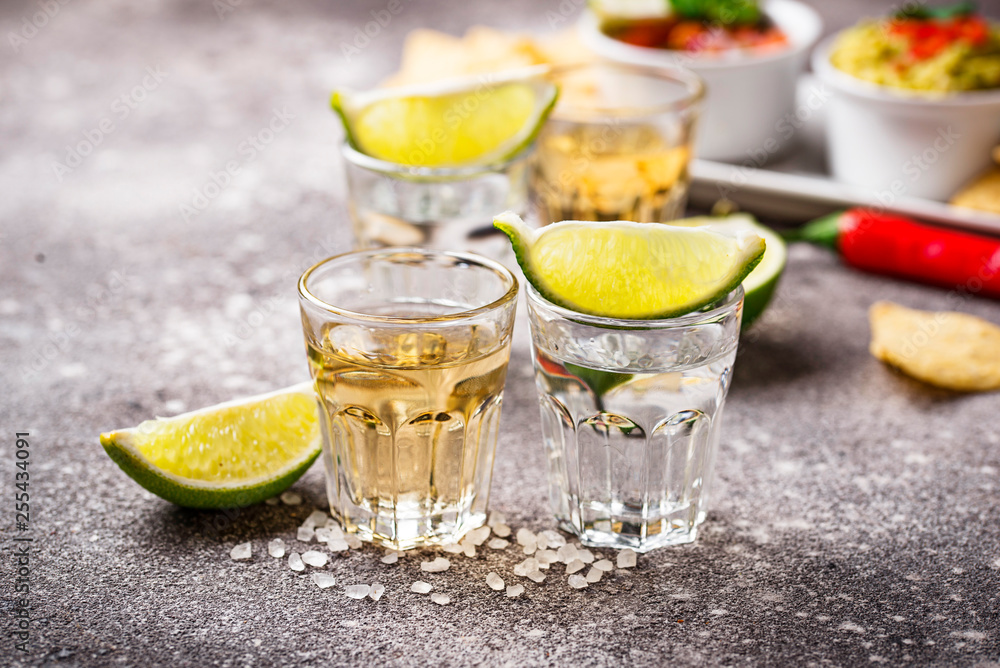 Shots of silver and gold tequila