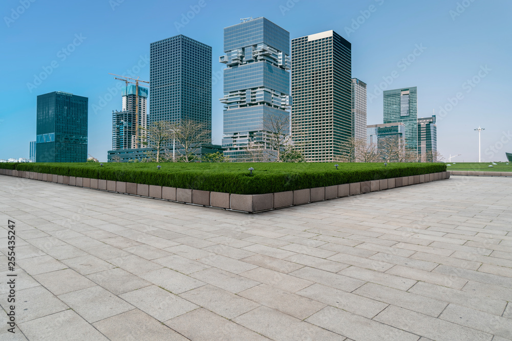 Urban skyscrapers with empty square floor tiles