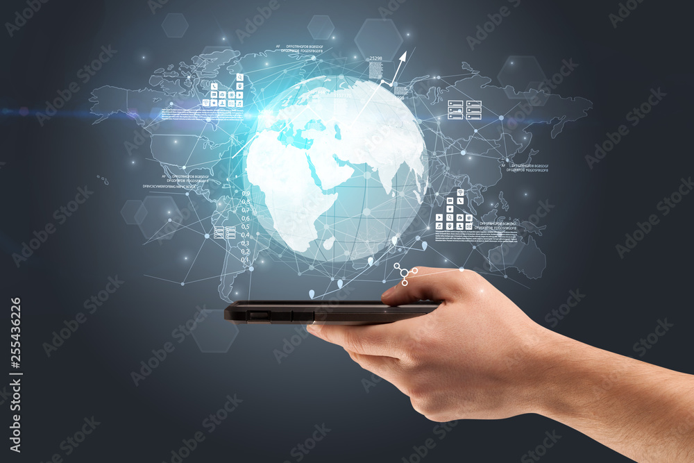 Hand using phone with multinational worldwide estate report concept
Hand using phone with multinational worldwide estate report concept