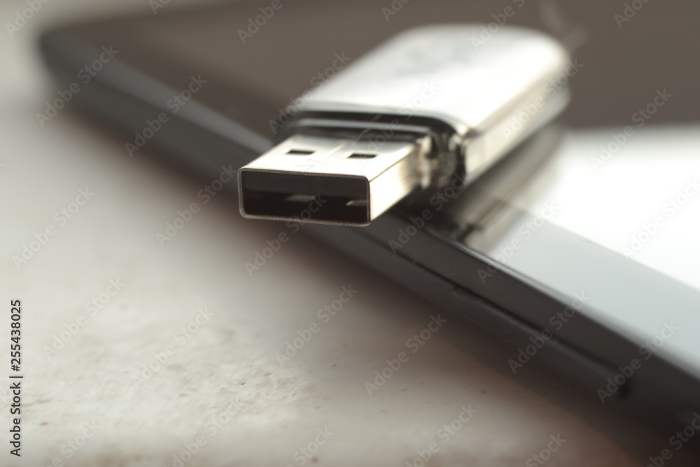 USB drive resting on tablet USB drive resting on tablet