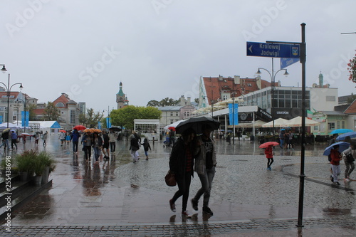 People in the rain with umbrellas on the promenade Sopot Poland