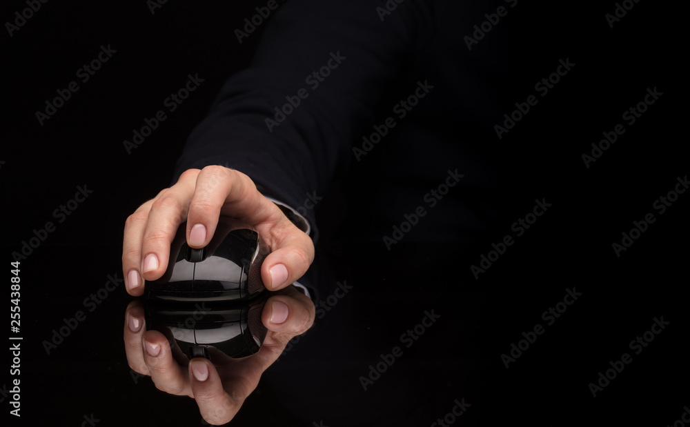 Hand using wireless mouse in a dark environment
Hand using wireless mouse in a dark environment