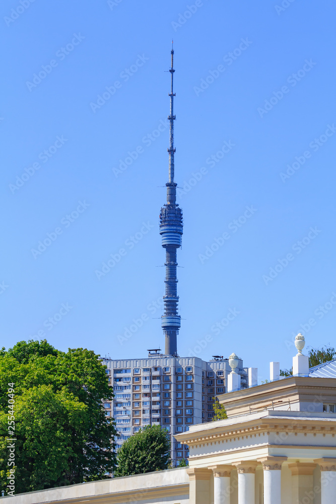 Obraz premium Ostankino TV Tower in Moscow on a background of buildings in sunny summer morning