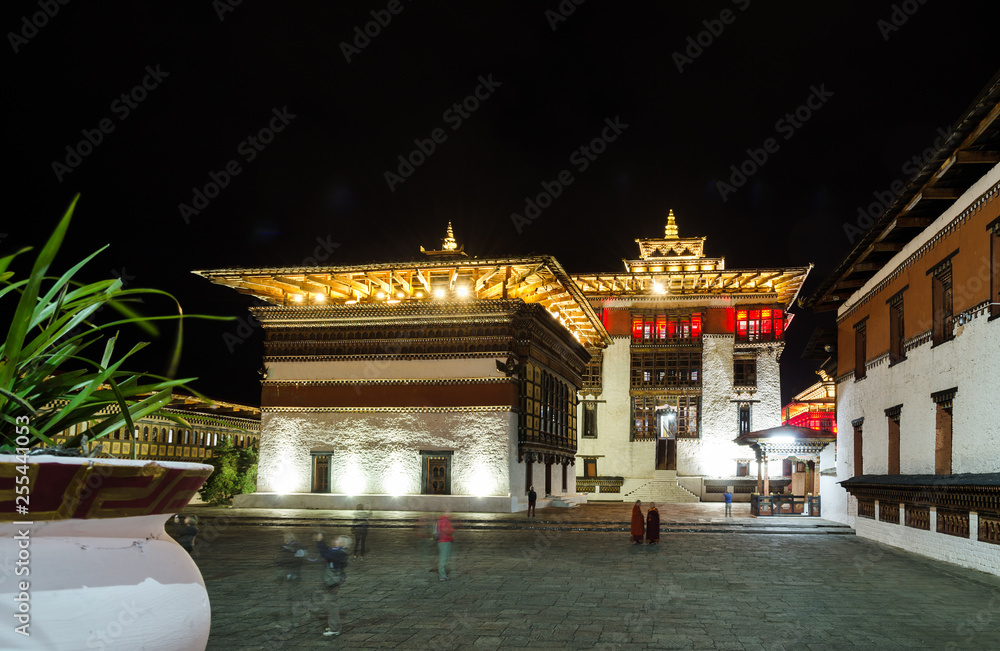 Tashichho Dzong at night, Thimphu, Bhutan Towers topped by triple-tiered golden roofs.  The central Tower is called Utse.