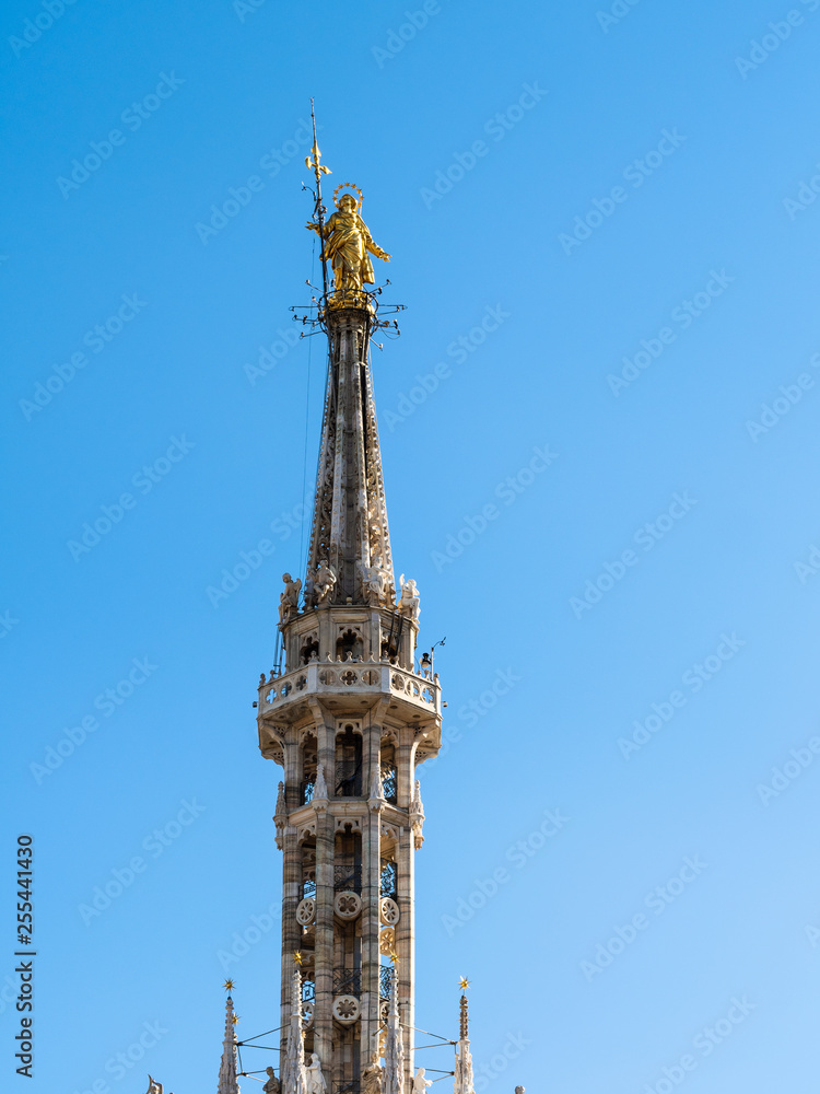 Madonnina golden statue on top of Milan Cathedral Madonnina golden statue on top of Milan Cathedral