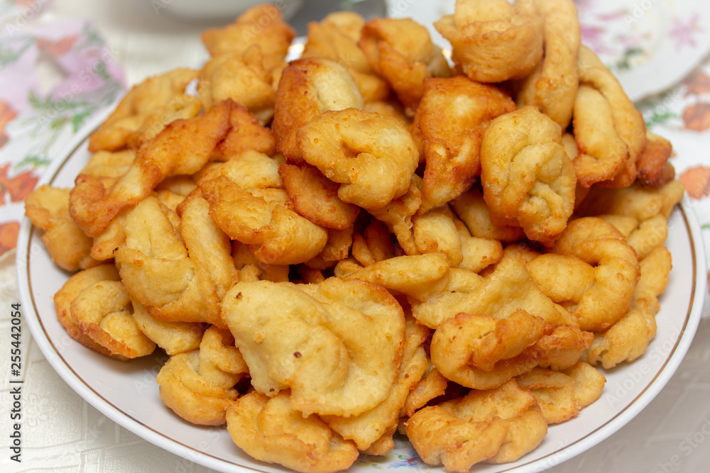A large plate of delicious and fragrant donuts A large plate of delicious and fragrant donuts