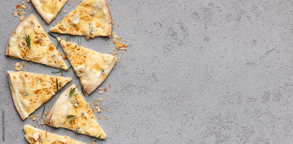 Four cheese pizza cutted into slices, top view Four cheese pizza cutted into slices, top view