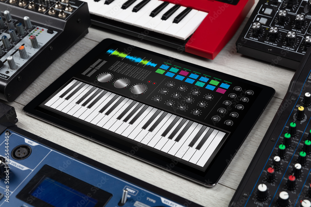 Piano synthesizer app on tablet and musical instrument concept
Piano synthesizer app on tablet and musical instrument concept