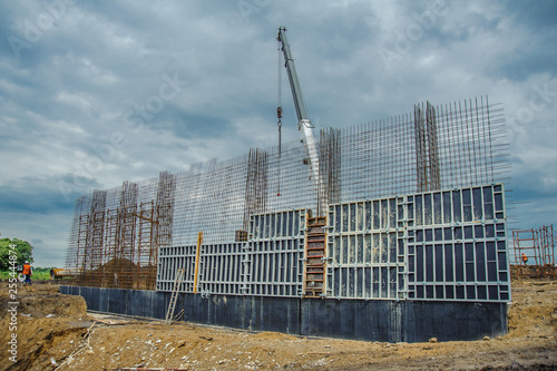 Wallpaper Mural Wall form panels bonded clamp on the background of a crane and clouds Torontodigital.ca