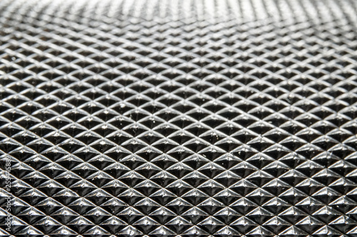 Wallpaper Mural Abstract macro close-up of industrial black color circular metal part with dense pyramid pattern relief in partial focus  Torontodigital.ca